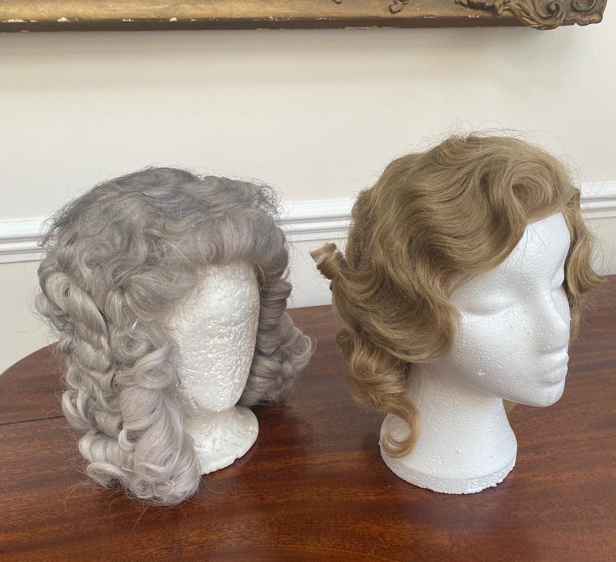 A lady’s 1930’s real hair wig with lacing and a men’s 18th century style acrylic wig